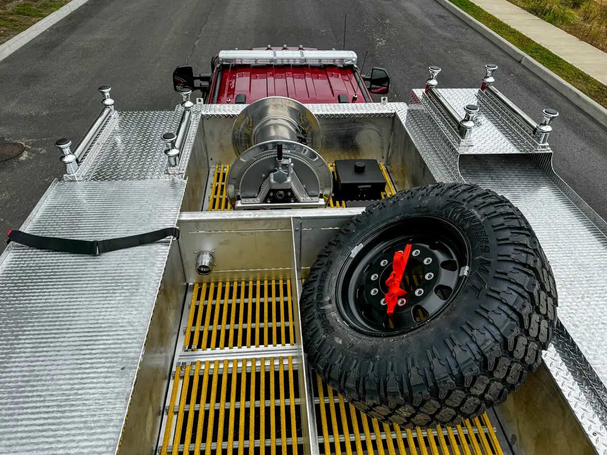 Top equipment-bay close-up with grating floor and mounted hardware.